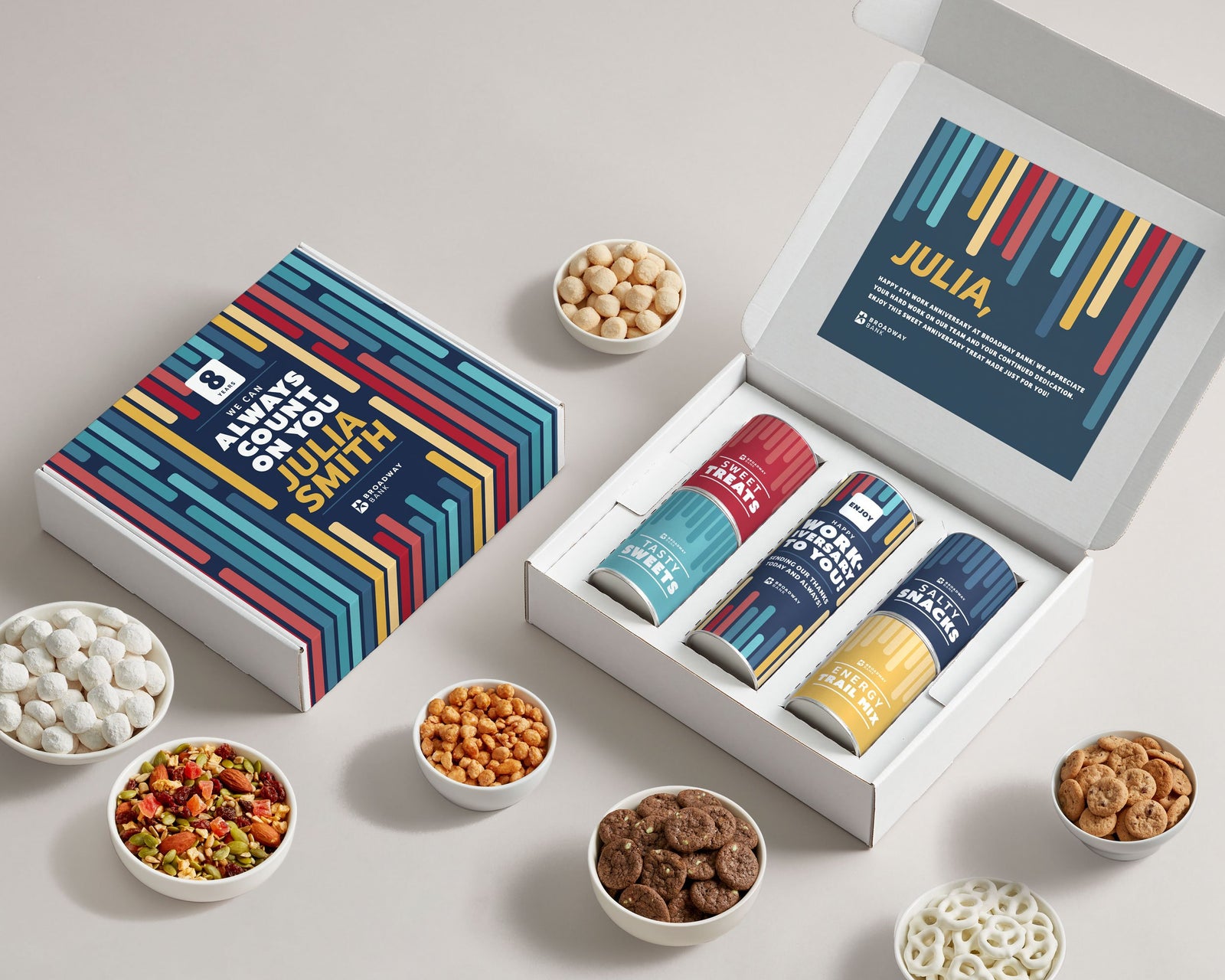 Custom branded employee gift boxes on modern office desk